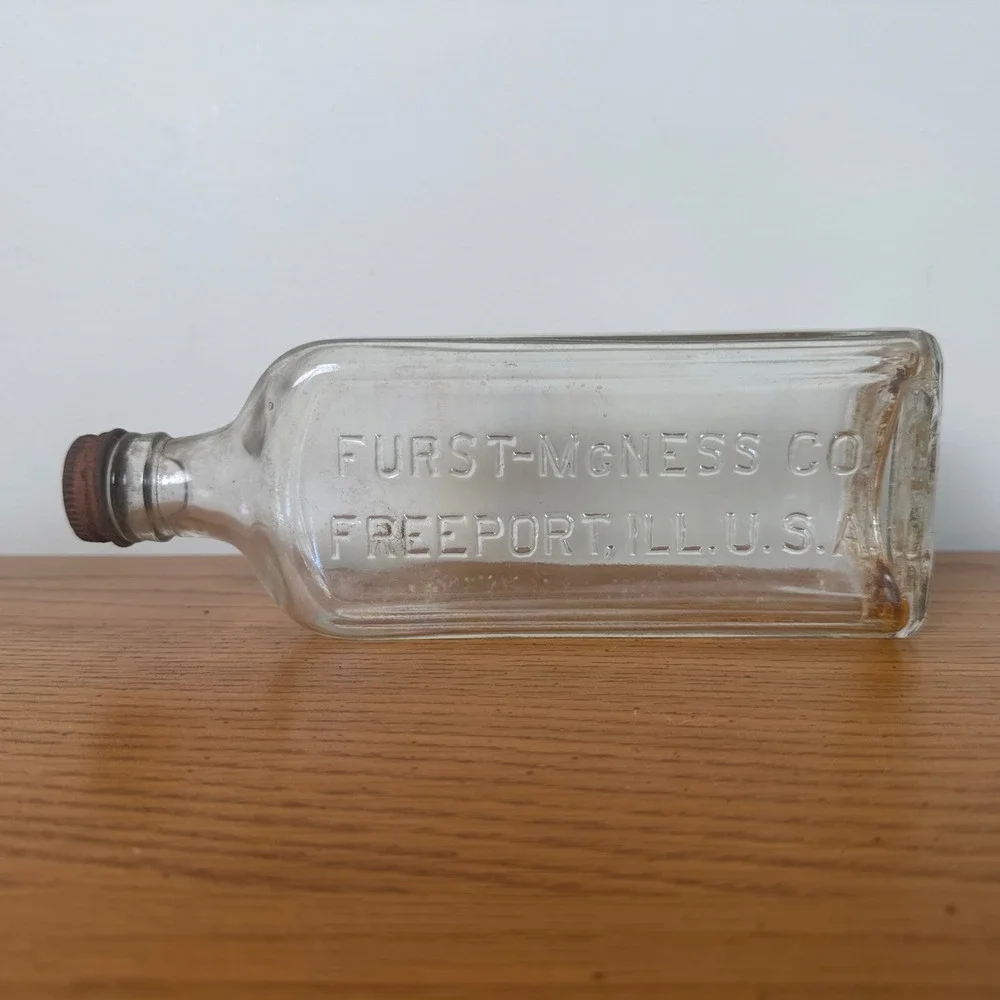 Vintage Furst-McNess Co‎ Freeport ILL USA Embossed Clear Glass Bottle Rusty Cap